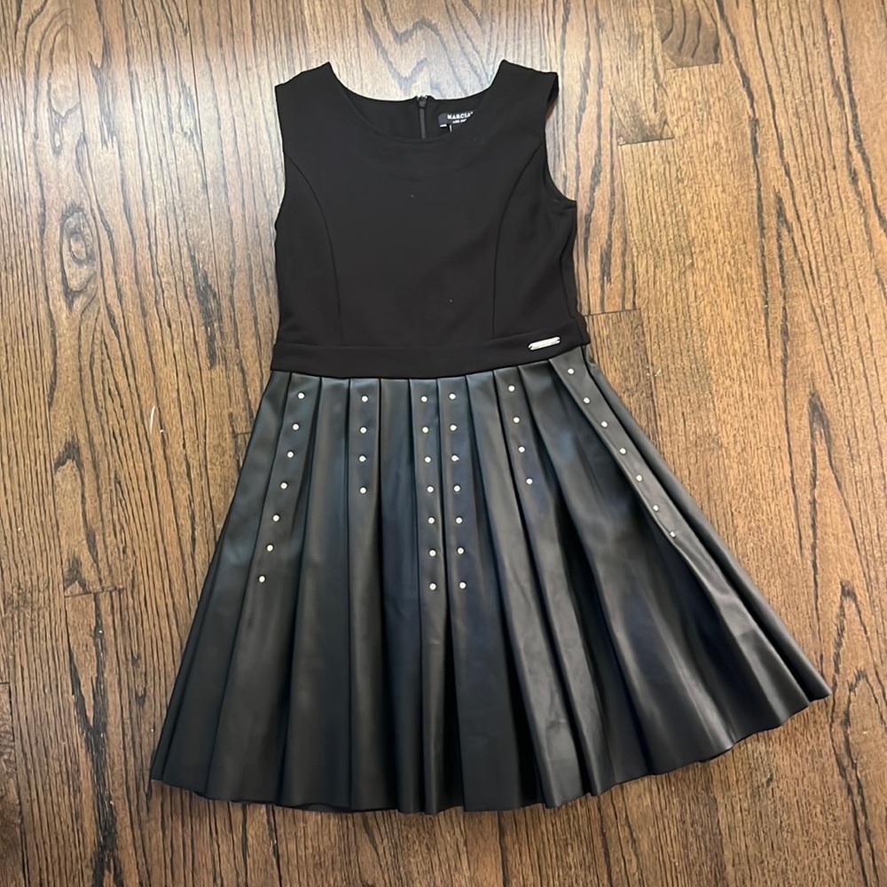 Black dress with metal dots on skirt